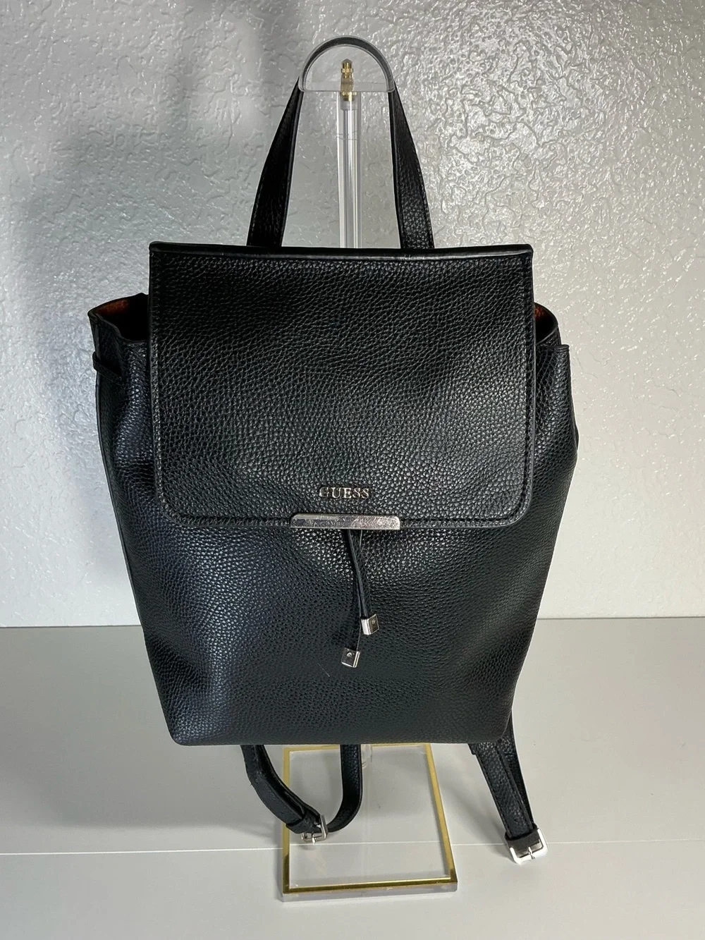 GUESS Black Pebbled Leather Drawstring Backpack with Gold Hardware